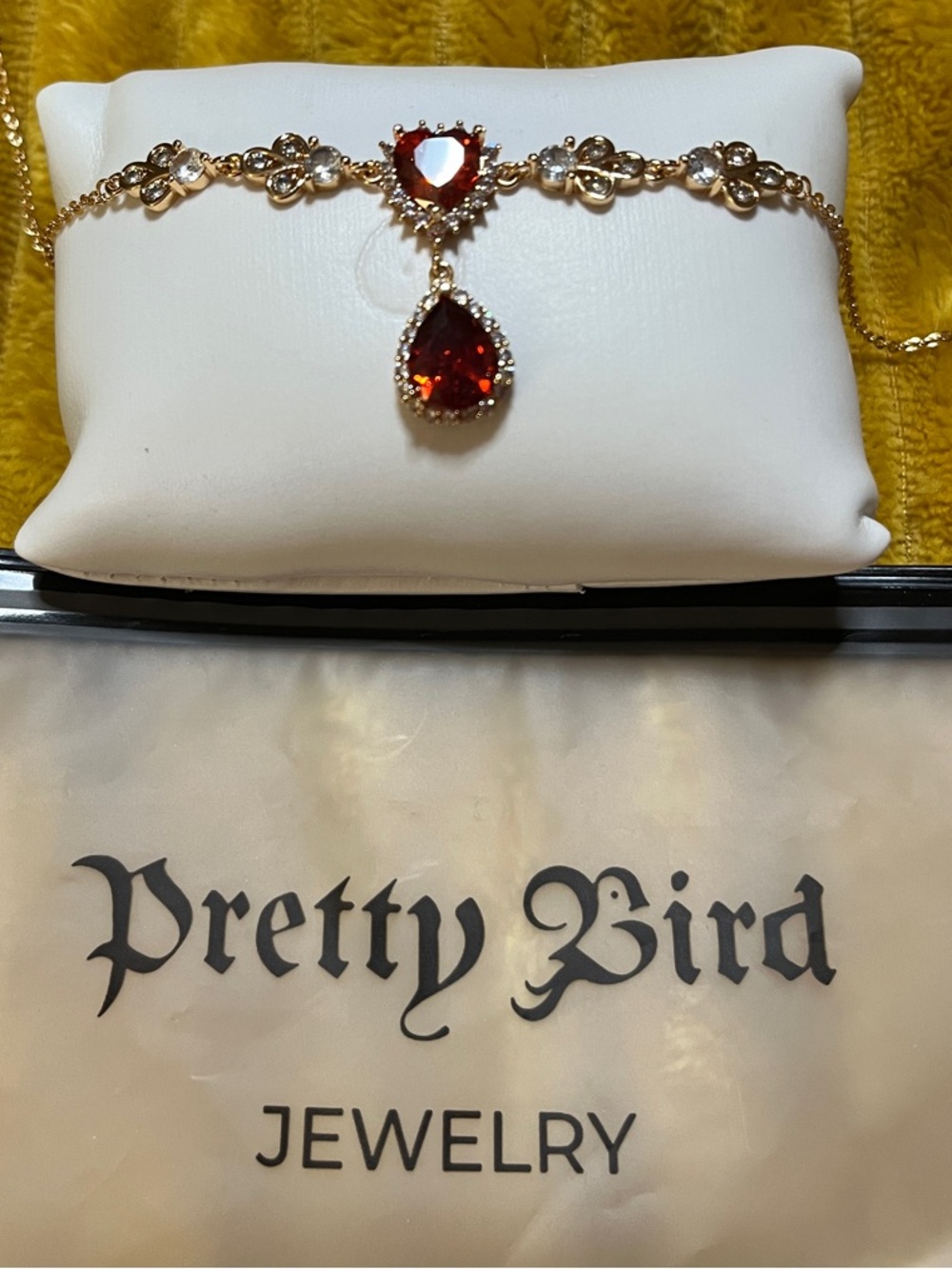 Pretty Bird Gold Necklace with Red Heart and Teardrop Stones